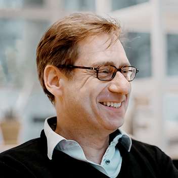 Portrait of smiling Lothar in coworking space