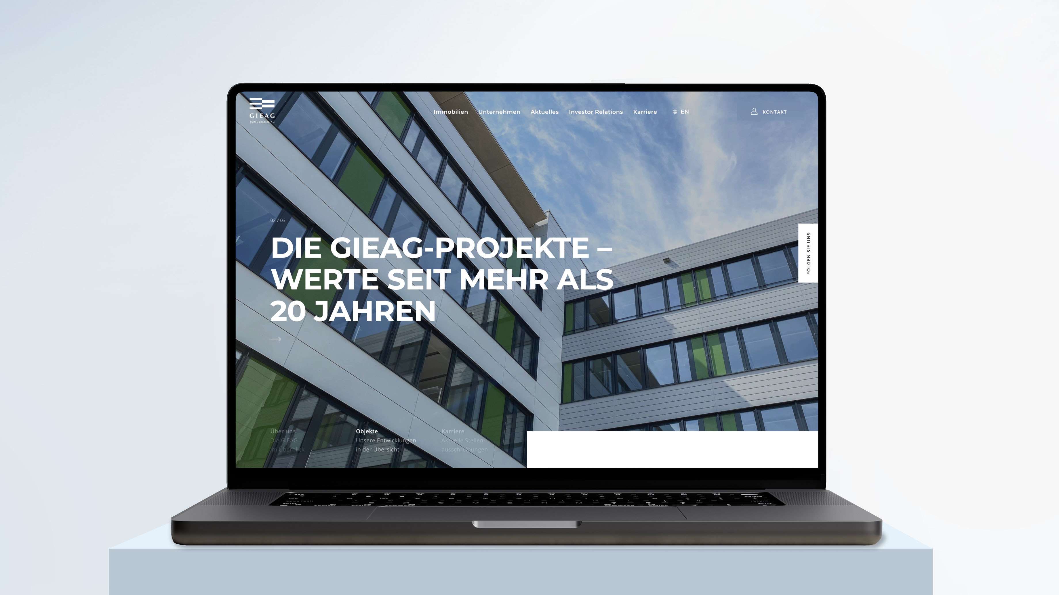 Mockup of the GIEAG website in a Macbook with hero image and the claim “The GIEAG projects – more than 20 years of value”