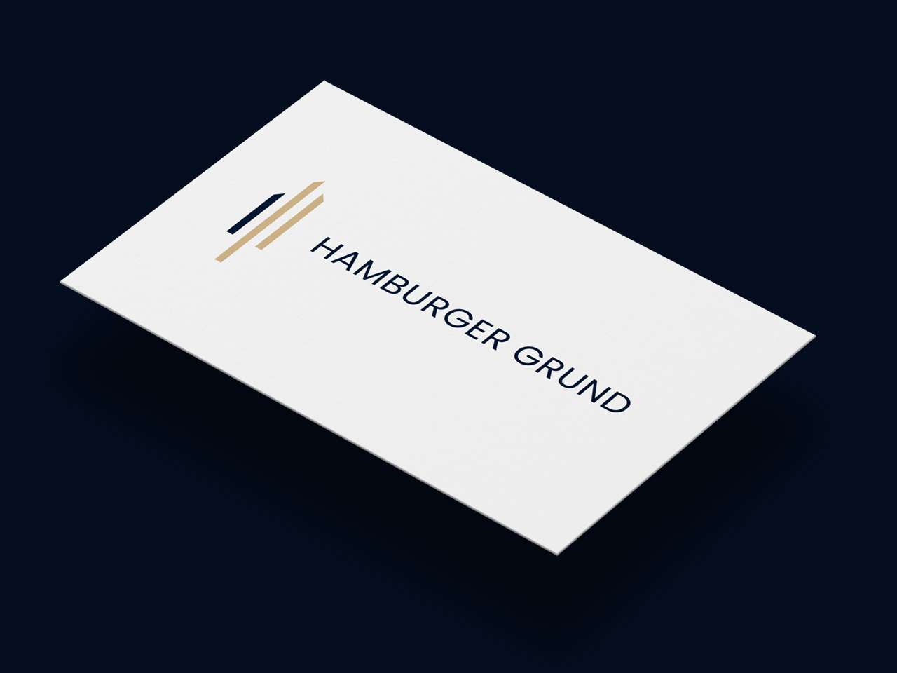 Detailed view of a business card from Hamburger Grund in white with logo
