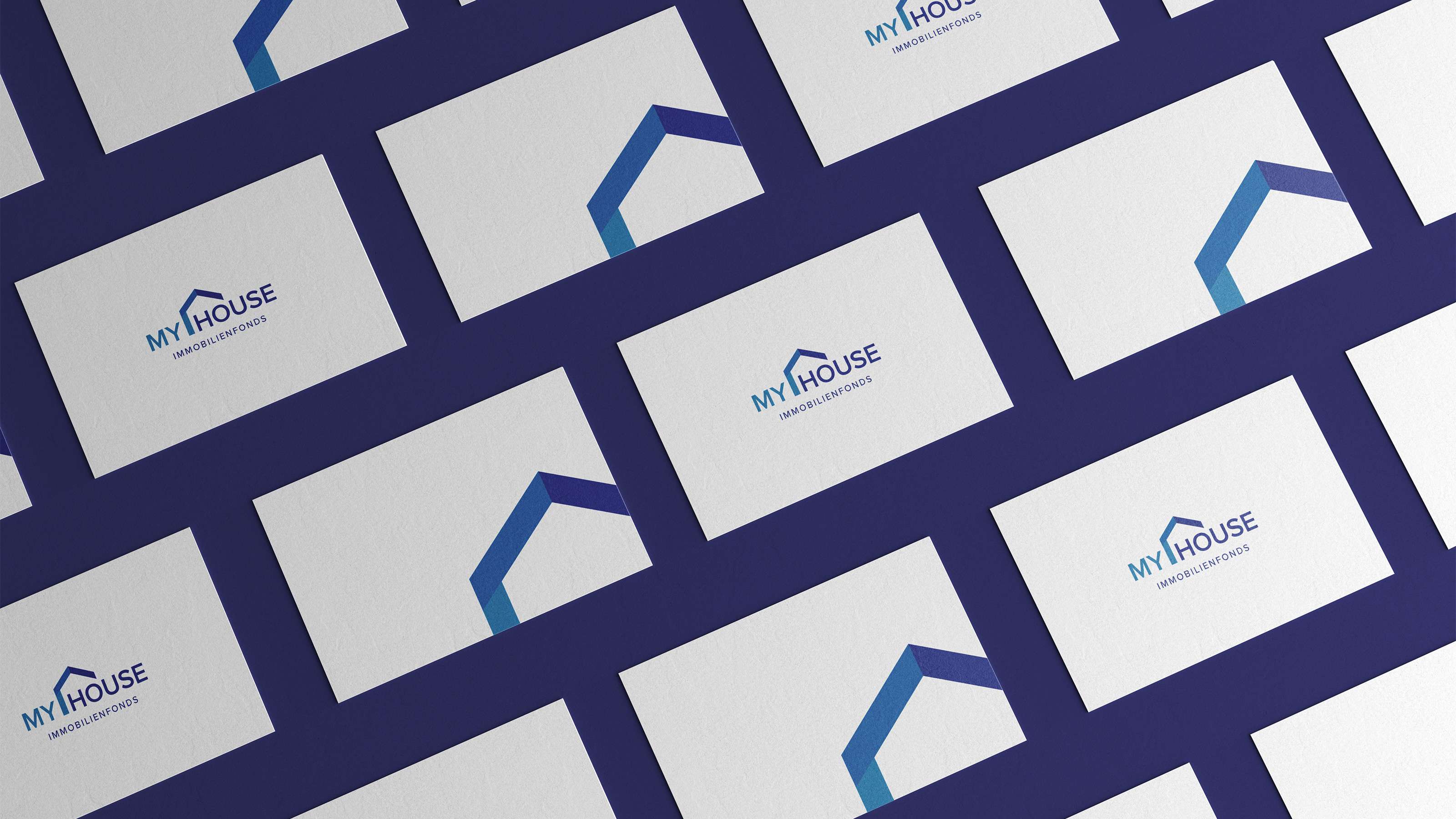 Mockup of several business cards from My House arranged as a grid with the logo and symbol alternating