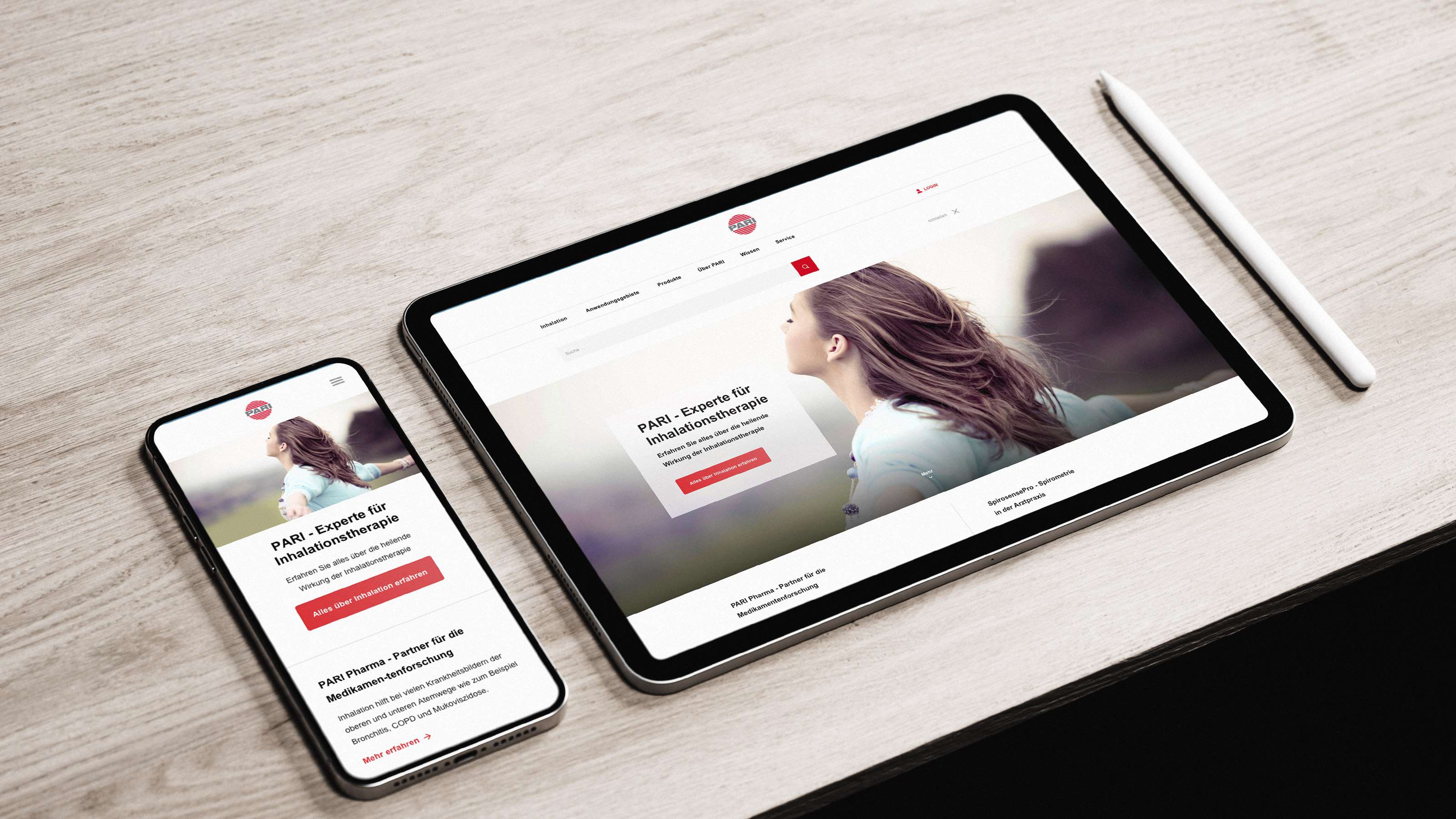 Mockup of the PARI website on a smartphone and a tablet, the hero image shows a brunette woman with outstretched arms taking a deep breath in nature