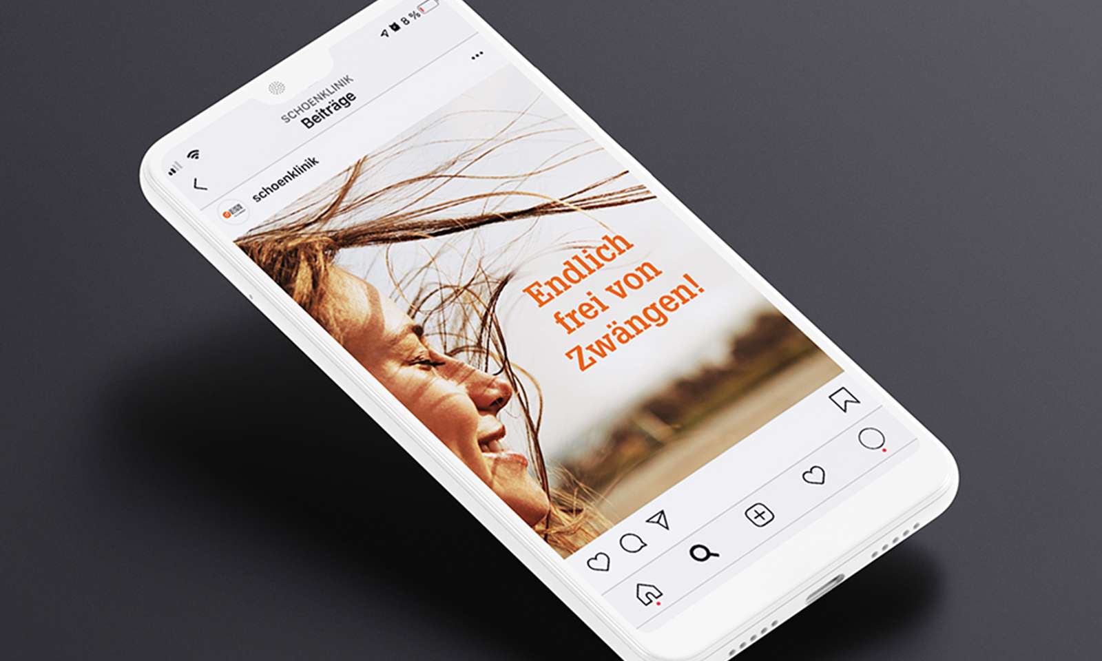 Mockup of an Instagram post from the Schön Klinik social media campaign in a smartphone with the text “Finally free of compulsions”