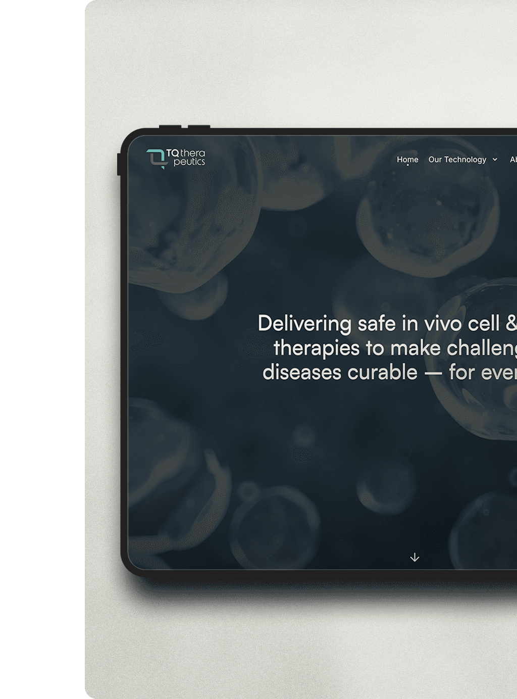 Part of a tablet shows the home page of the TQ Therapeutics website, an abstract image with cells behind a block of text that is unreadable because of the crop.